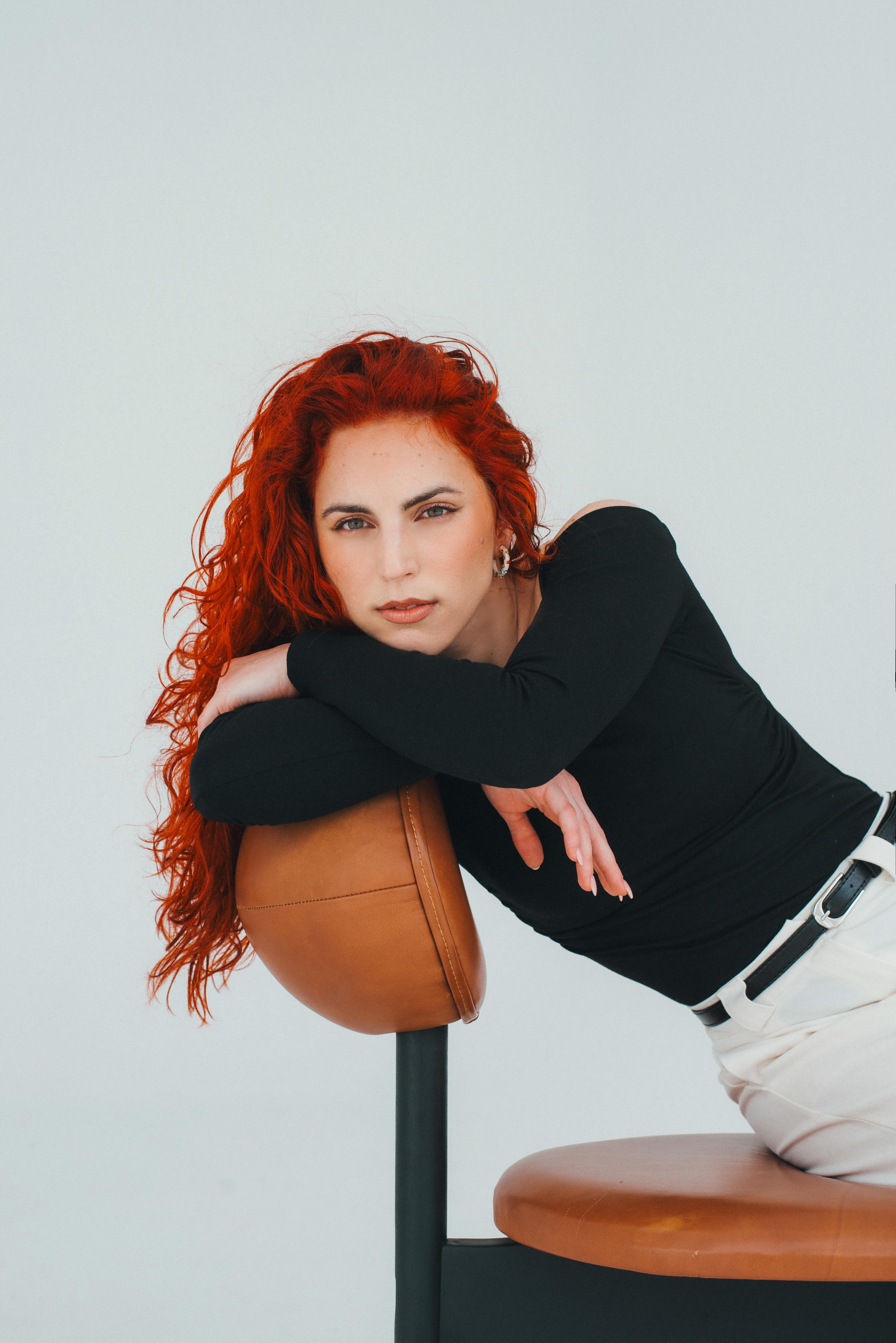 Lana Maletić — studio portrait, off-shoulder, leaning on chair